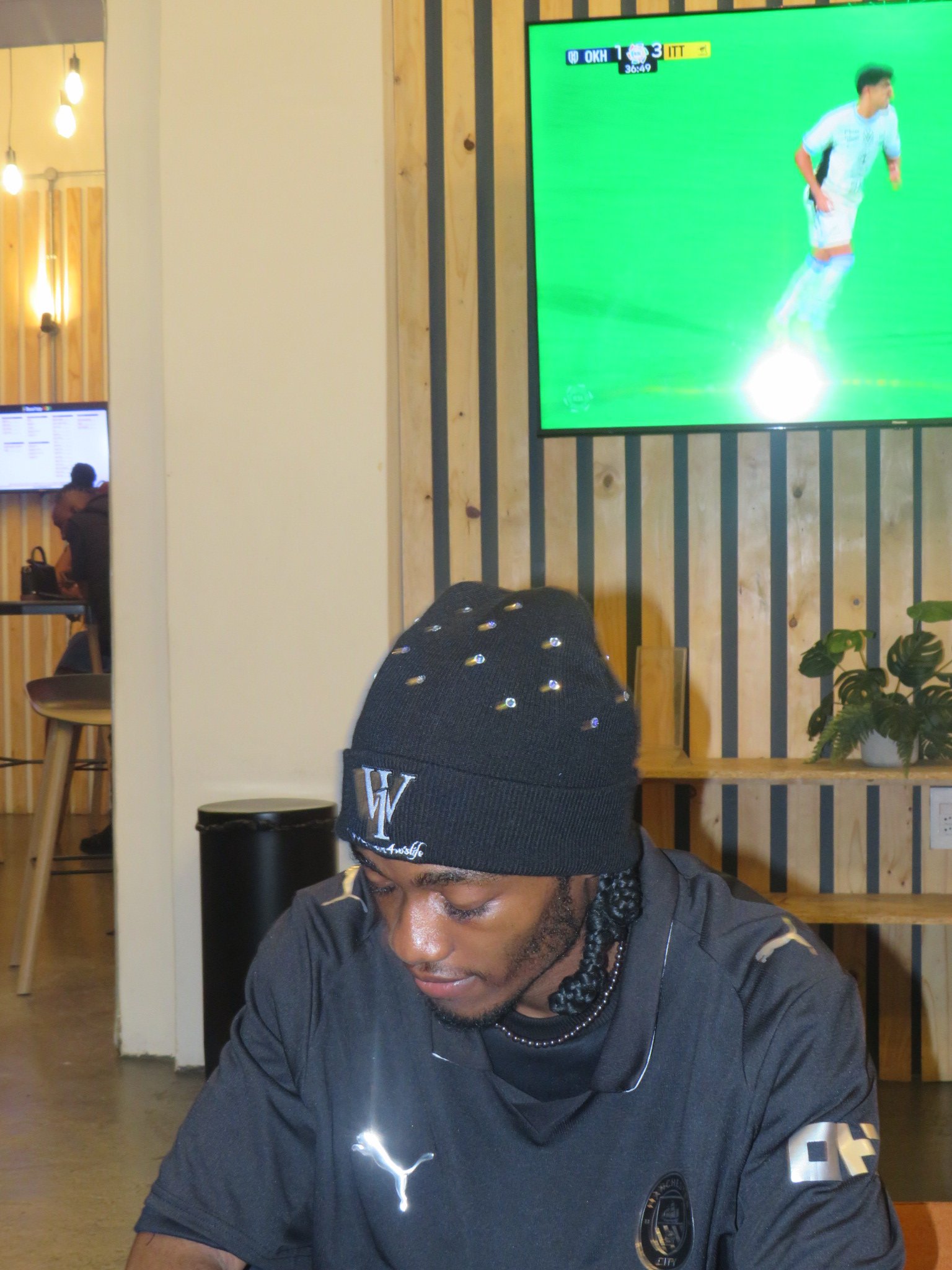 Black beanie, side view