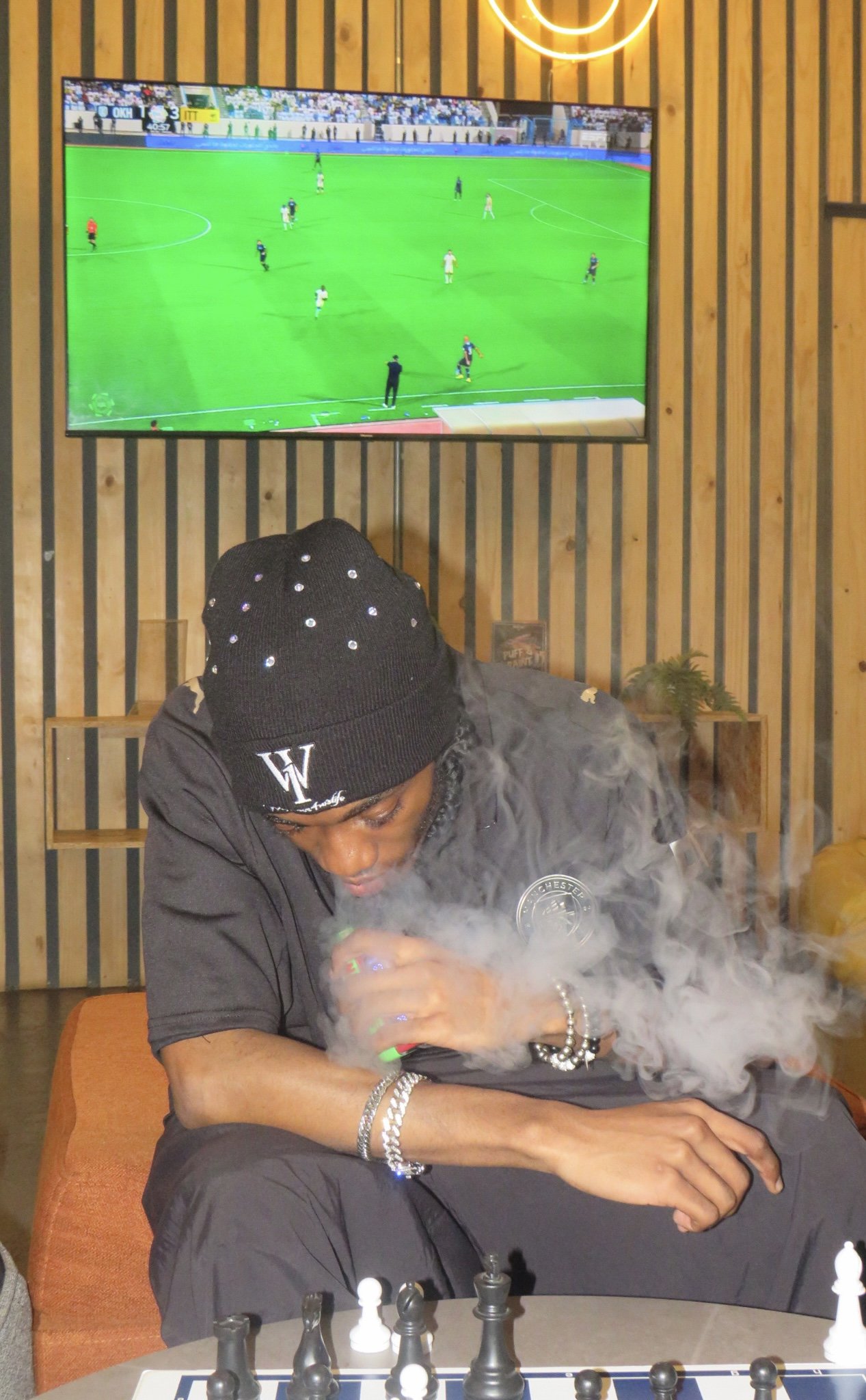 Black beanie worn at a table