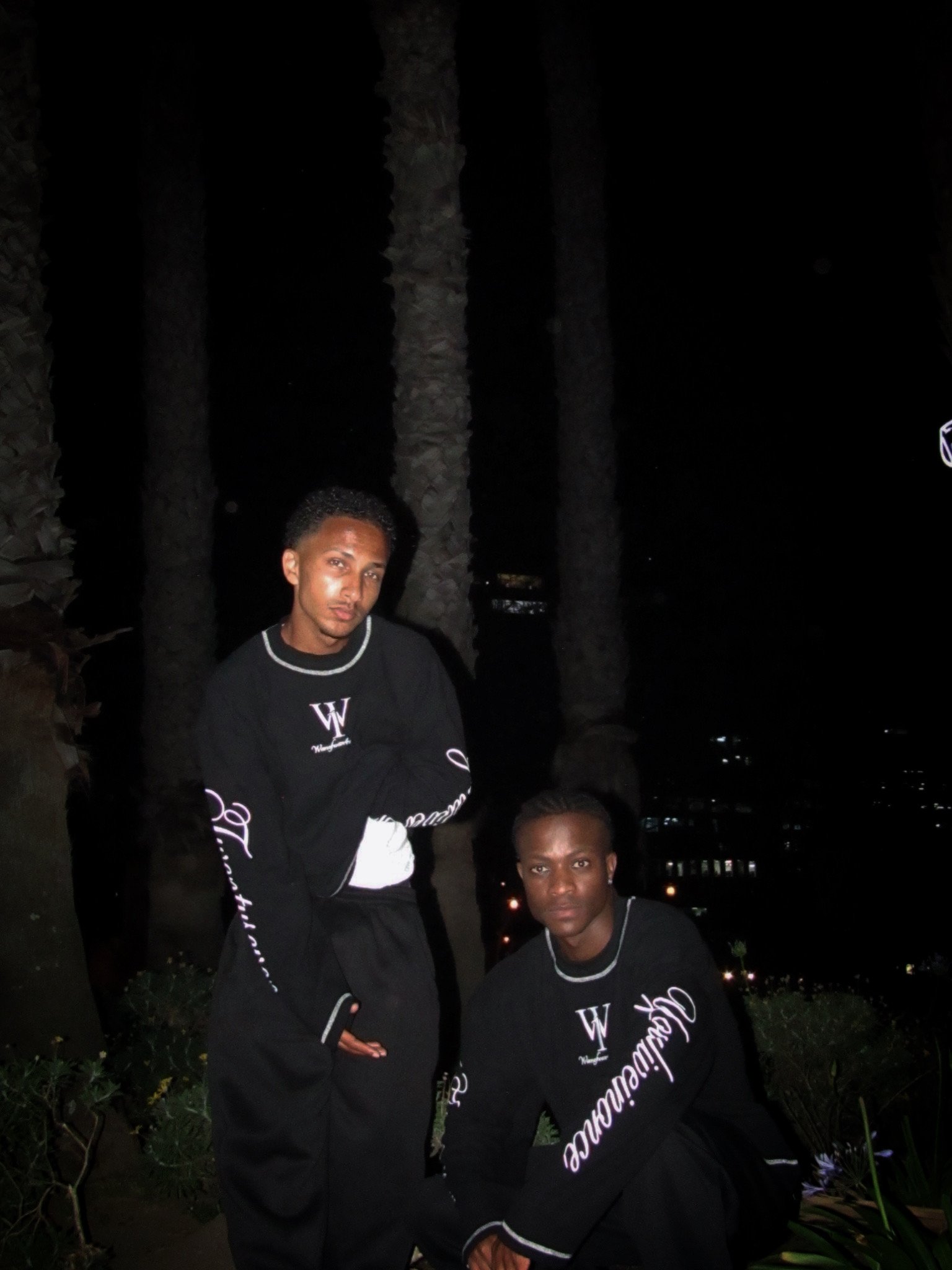 Black tops styled outdoors at night
